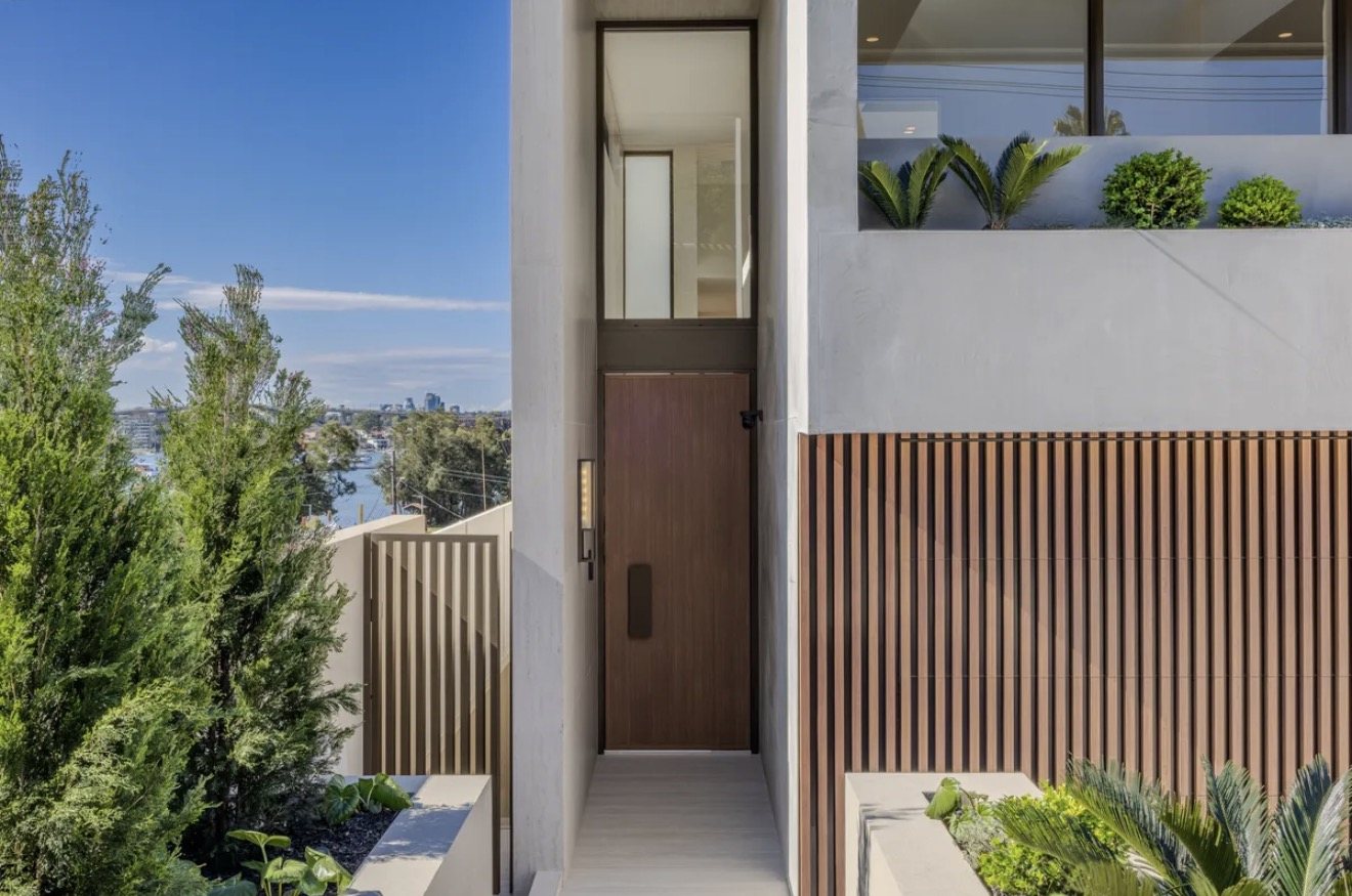Entry with timber door and rendered walls, Russell Lea