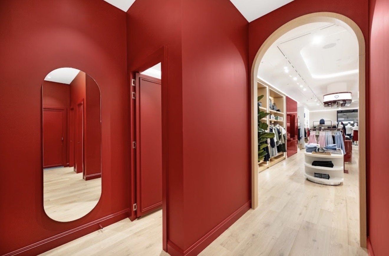 Deep red fitting room corridor with timber arch, Tommy Hilfiger Chatswood Chase
