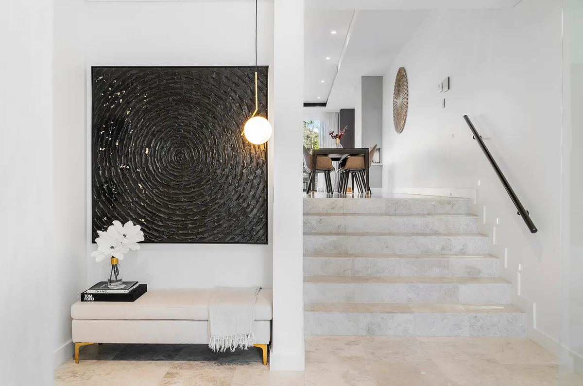 Entrance with feature artwork and stone stairs, South Hurstville