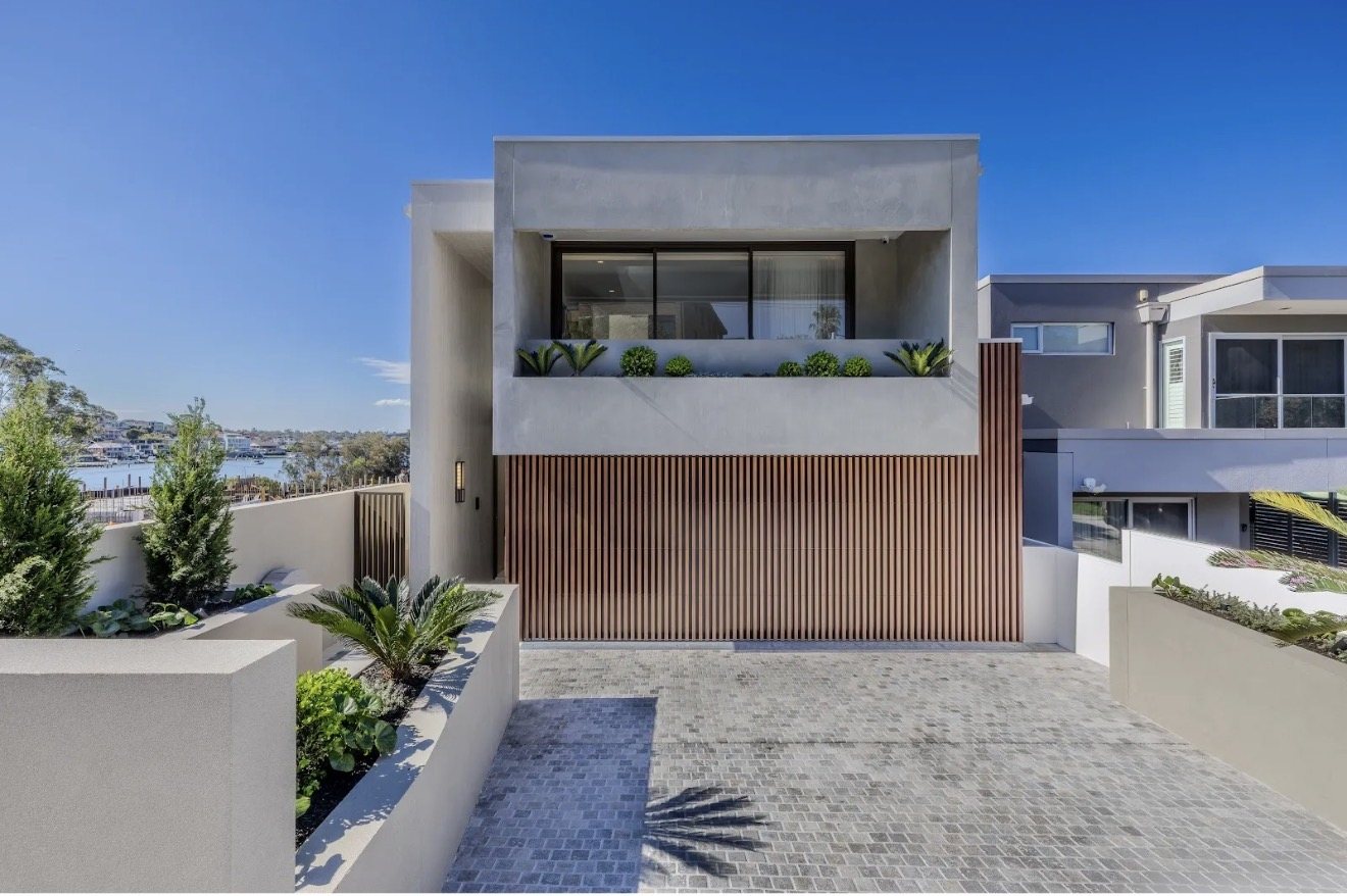Rendered front facade with timber battens and water views, Russell Lea