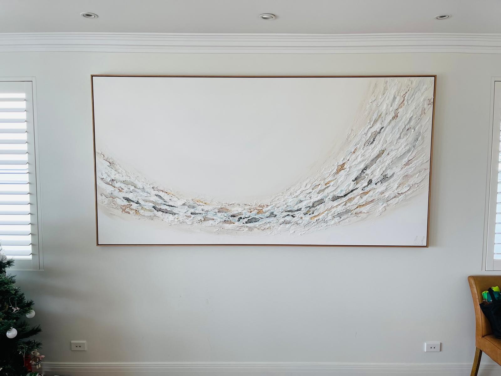 Wide feature artwork installed between windows