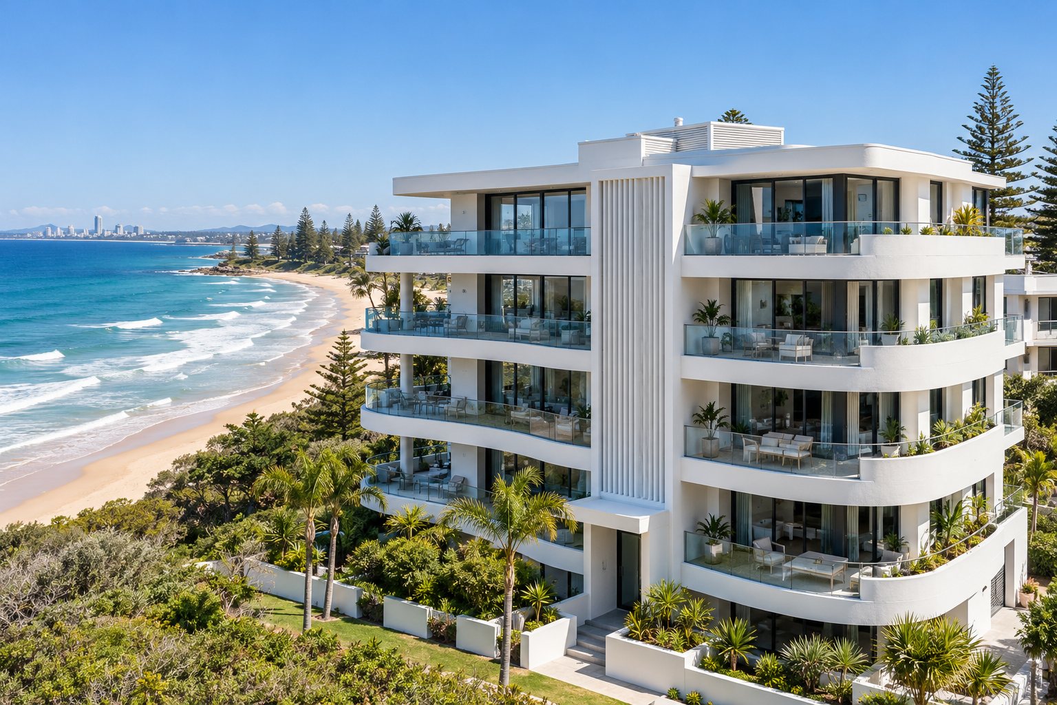 White coastal apartment building with curved balconies